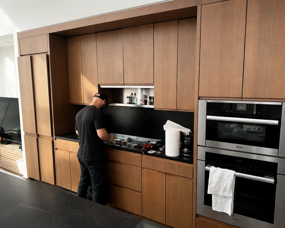 Built-in kitchen appliance repair in a Manhattan apartment